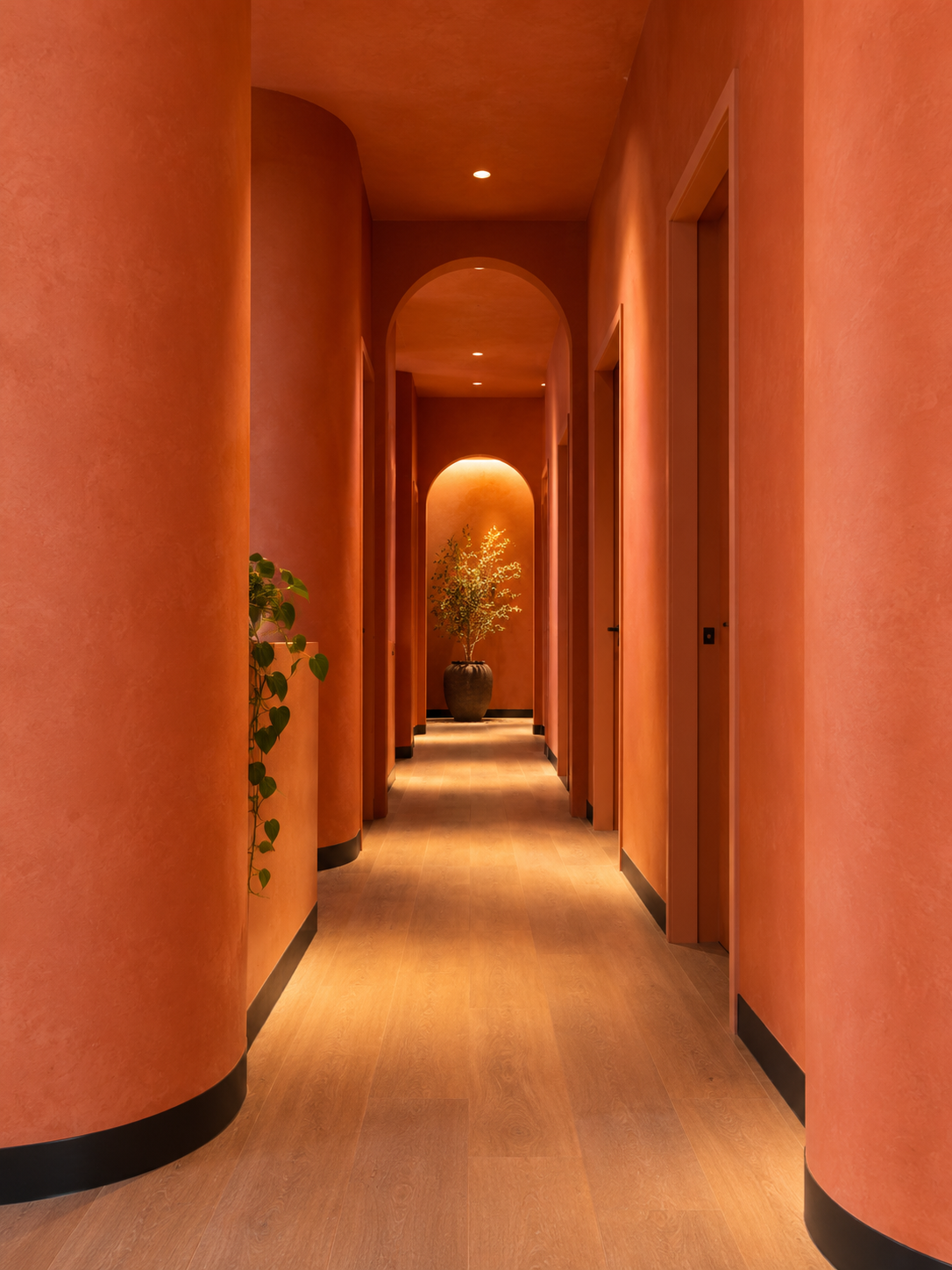 Clay-walled hallway under a skylight at Heal Bath House, East Brunswick